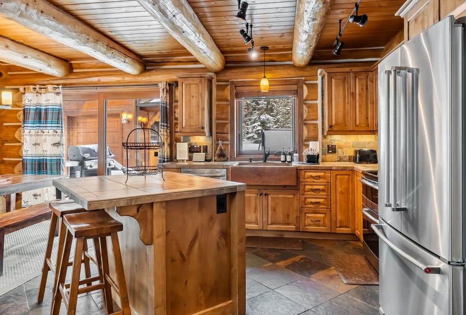 Kitchen: Main floor, drip coffee maker, toaster, blender, cooking utensils, tableware