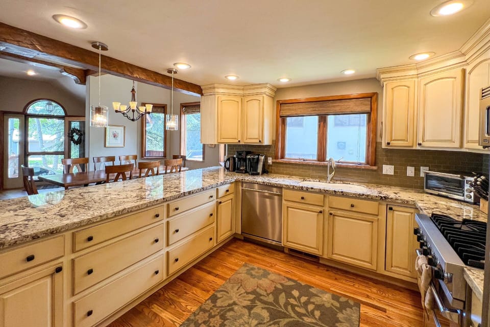 Stylish granite countertops and an open view to the dining and living room create the perfect backdrop for cooking and entertaining!