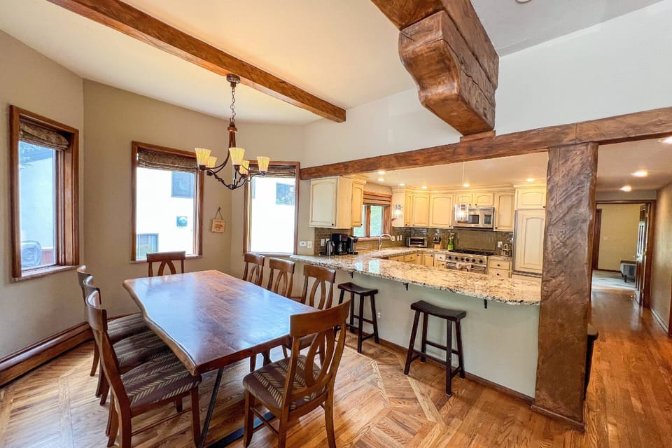 The kitchen bar opens up to the dining area, making it easy to enjoy meals and gather with loved ones.