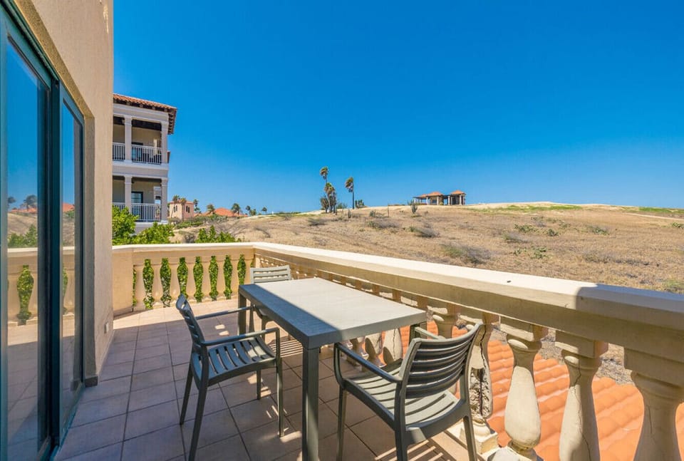 Enjoying serene views from the balcony, where relaxation meets nature.