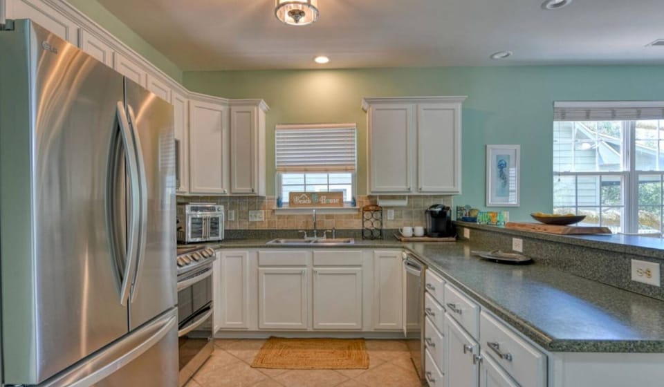 Kitchen with Full Size, Stainless Appliances, Granite Countertops and Breakfast Bar
