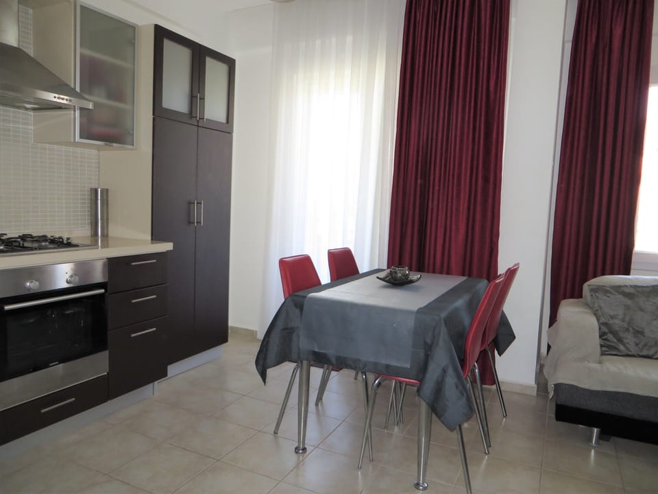 Open plan kitchen / dining area with first extendable table (seats six).