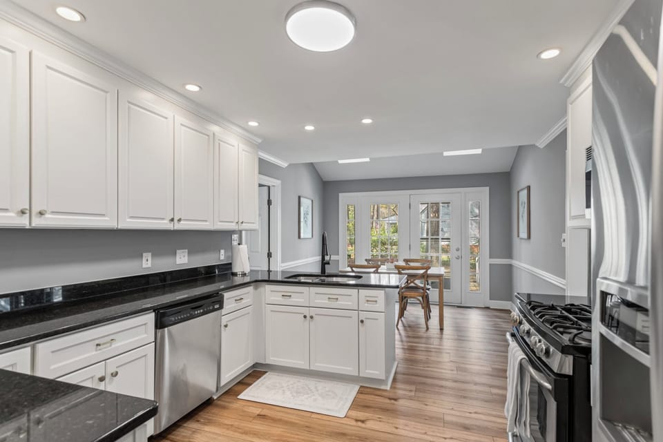 View of the spacious and bright kitchen fully stocked for preparing meals at home.