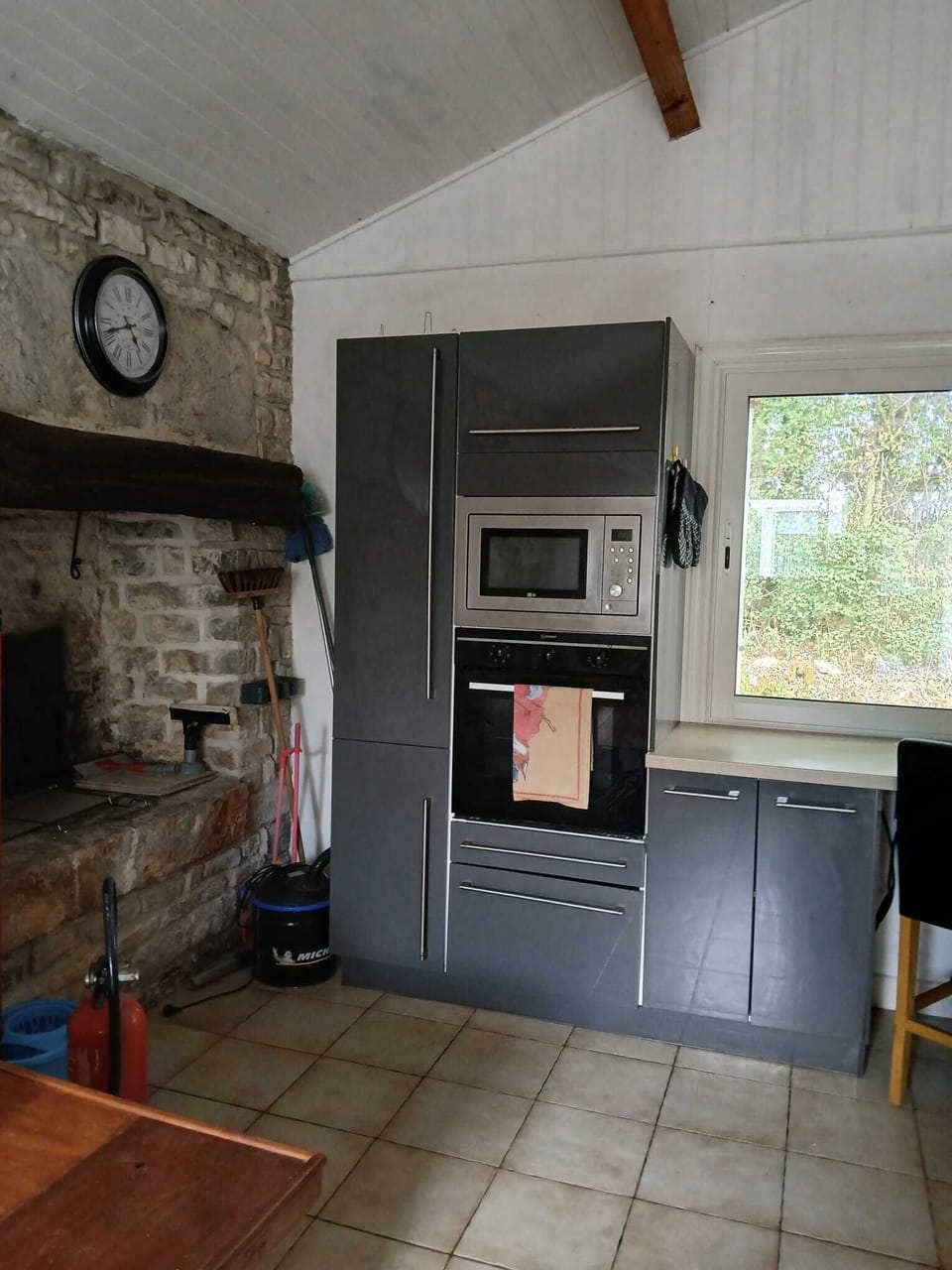 Microwave and one of the two ovens
