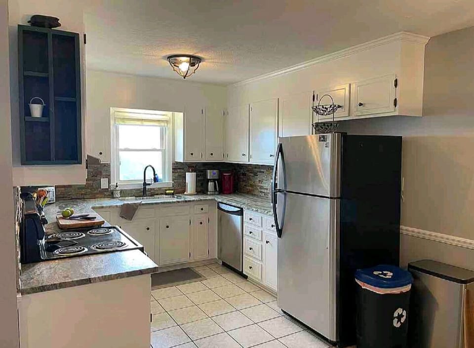 Fully stocked kitchen with gas range, dishwasher and ice maker