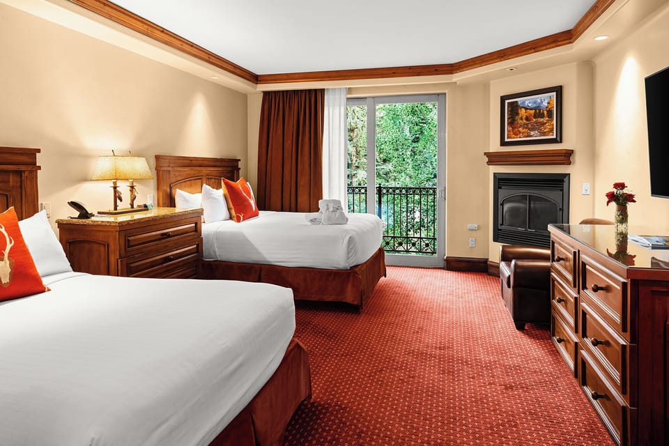 Breathe in fresh air by the balcony near the fireplace.