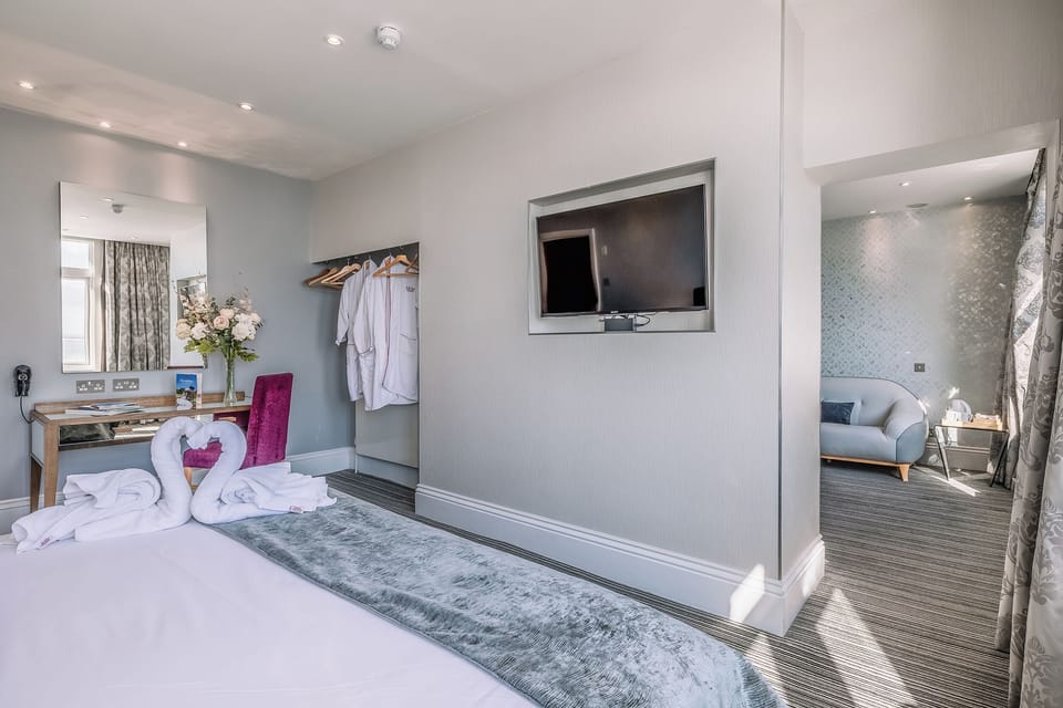 Settle in with robes, entertainment, and an airy suite layout.