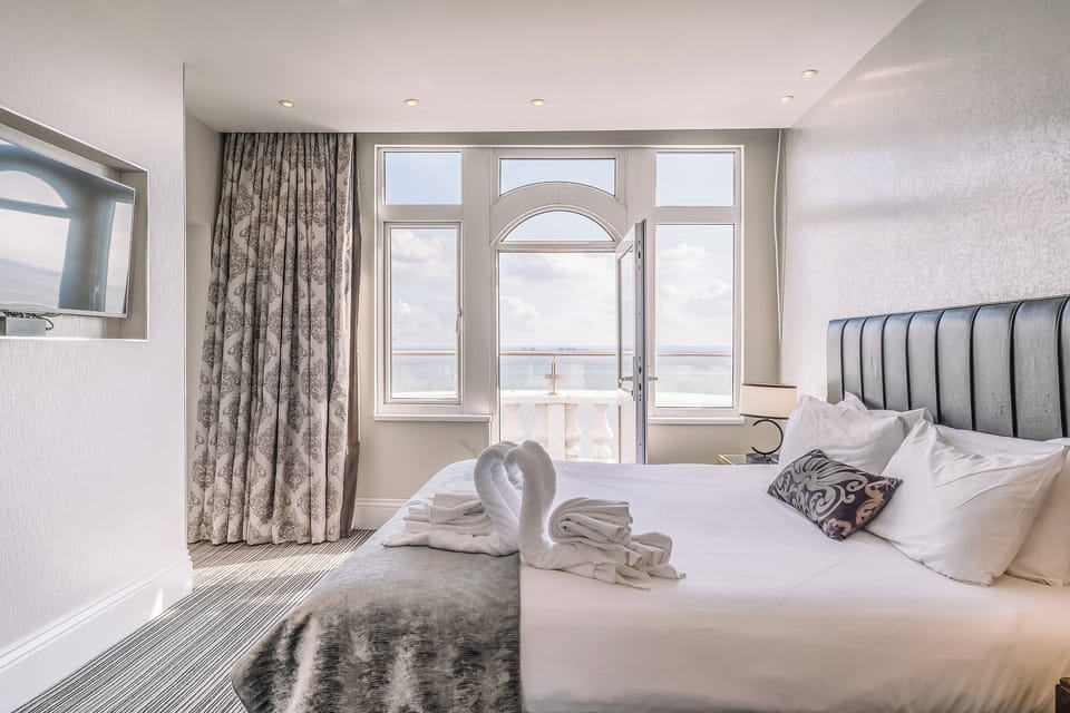 Step onto the balcony and greet the ocean from bed.