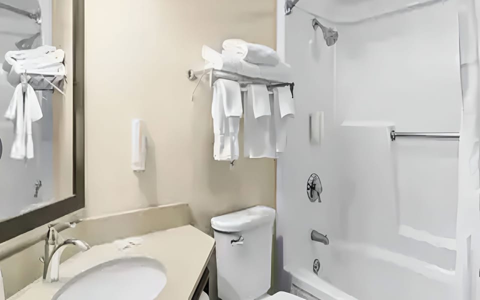 Refresh with a clean vanity area and easy tub access.