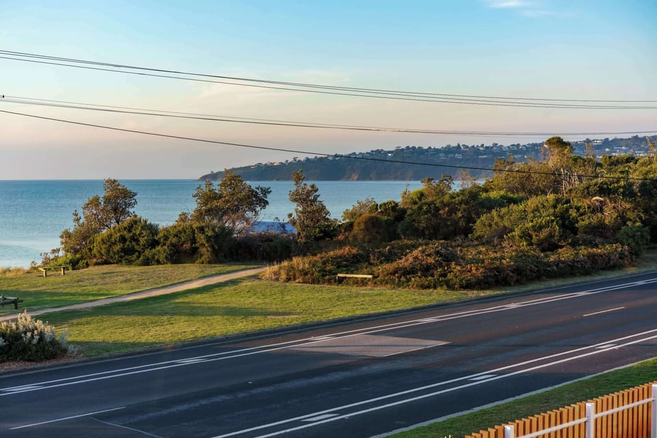 The views from the home extend toward Mount Martha