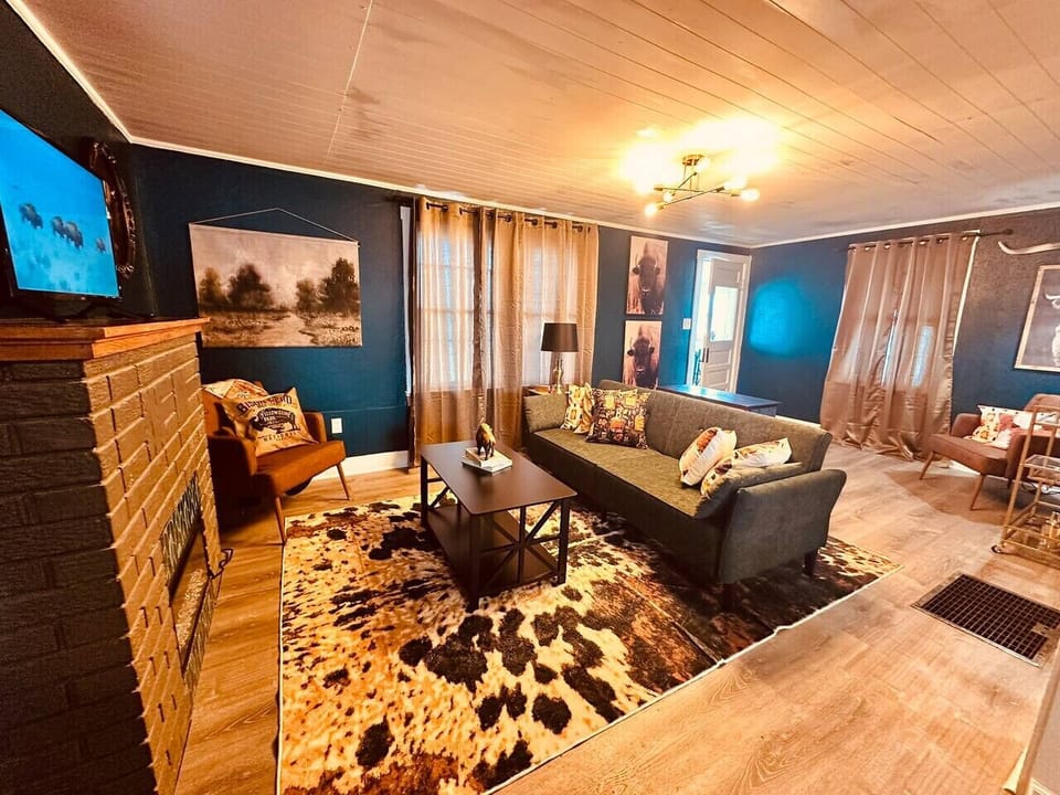 Rustic charm meets cozy comfort in the heart of the Buffalo & Bourbon Bungalow. Pour a glass, sink in, and stay awhile.