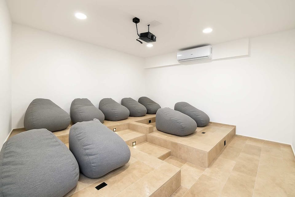 Cinema Room 
Unwind after a day in Tulum with your favorite film — this air-conditioned cinema room is perfect for movie nights, alone or with friends.