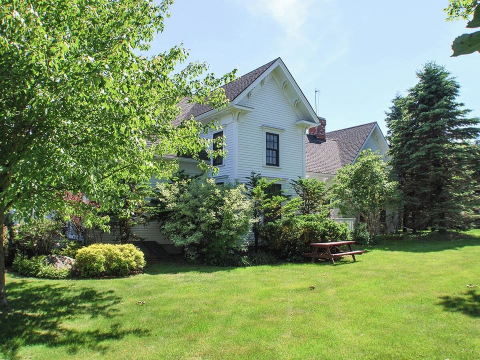 The side yard on the property offers a nice place to relax and enjoy the area. Please note the house is a shared unit with a long term renter on the back side.
