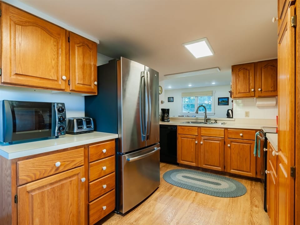 Kitchen area with updated stainless steel appliances