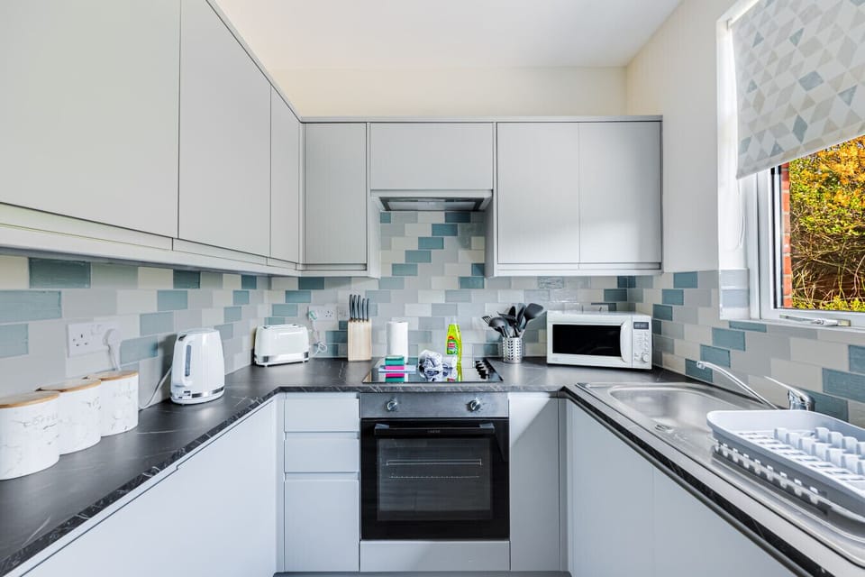 A fully equipped kitchen with everything you need to prepare a home cooked meal