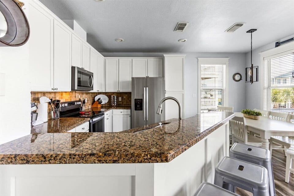 Serve casual bites to the kids from the bar stools overlooking the kitchen.
