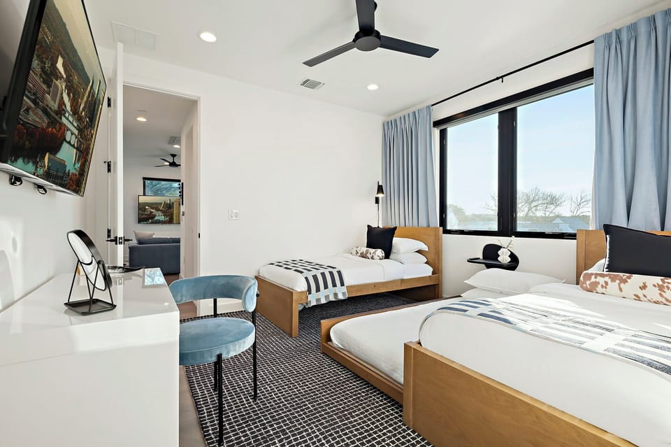 Bright and airy bedroom with two cozy twin beds