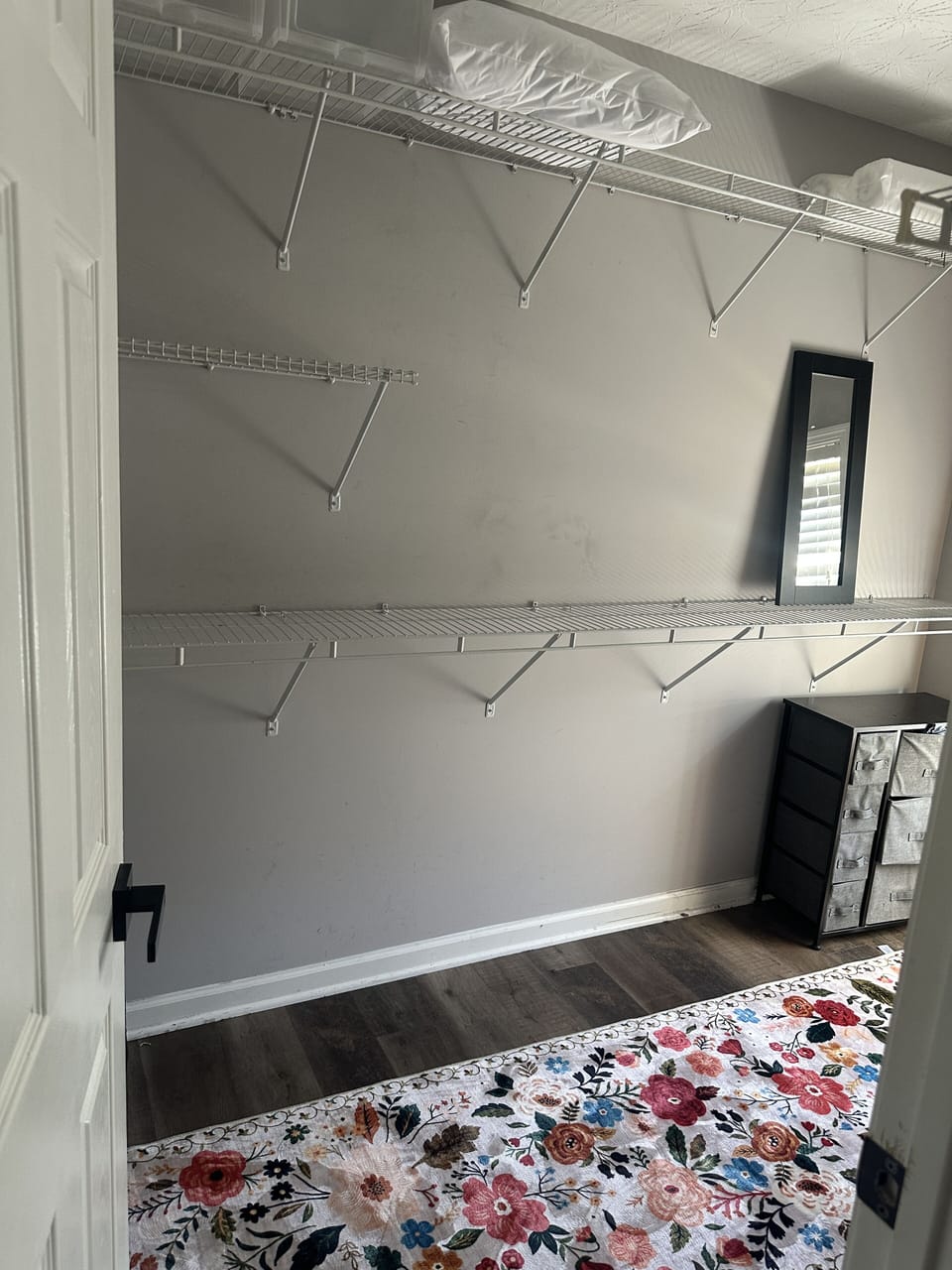 Walk in closet in primary bedroom