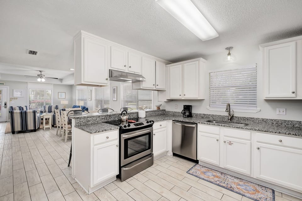 The kitchen is equipped with various appliances for a variety of cooking needs.
