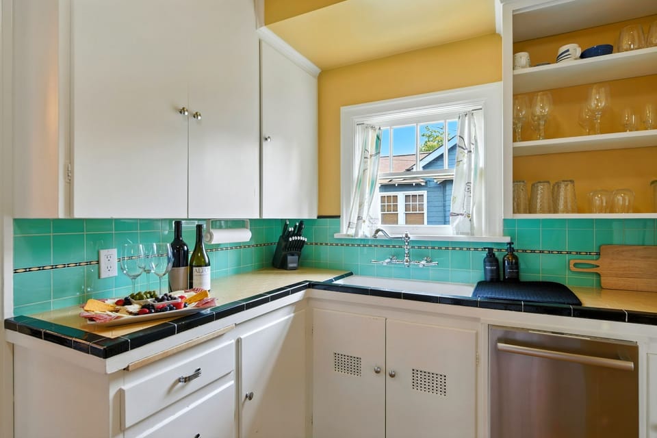 Charming, compact kitchen with a vintage, electric range.