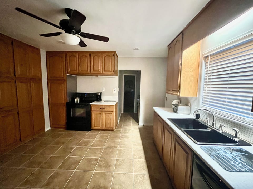 Large Kitchen + Hall into Laundry Room, Mudroom, Guest Bedroom 2 + Guest Bath 2