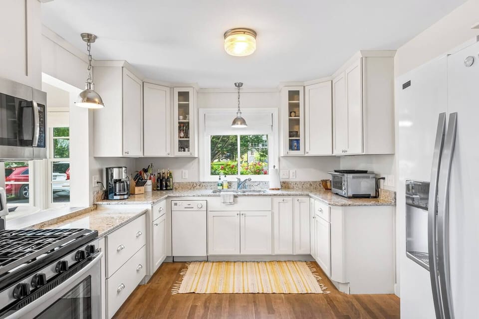 Fully stocked kitchen open to breakfast nook - perfect for serving up your morning coffee or tea!