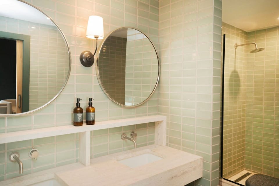 Start your day in a bright bathroom with rainfall shower.