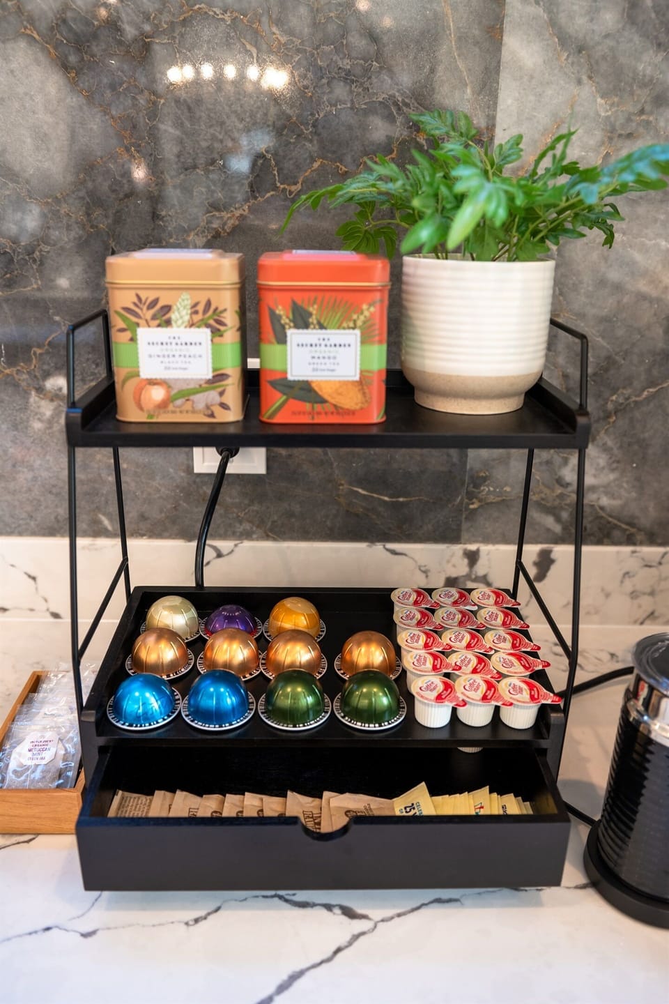 Coffee bar with complimentary coffee pods and tea.