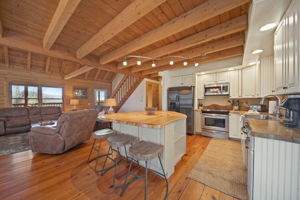 Kitchen features a Center Island with Barstool Seating for Three