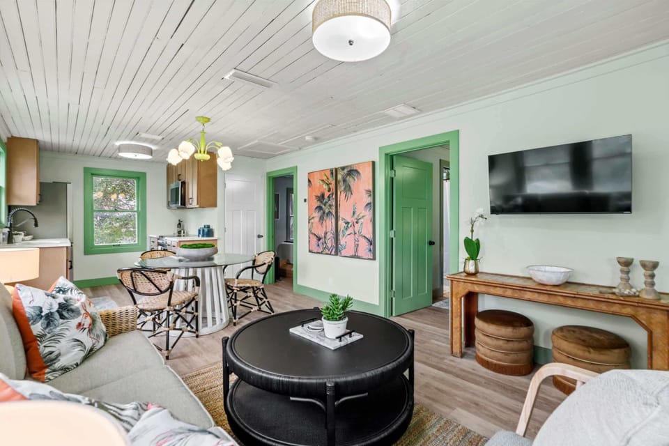 Gather around the coffee table in this bright, airy living room.