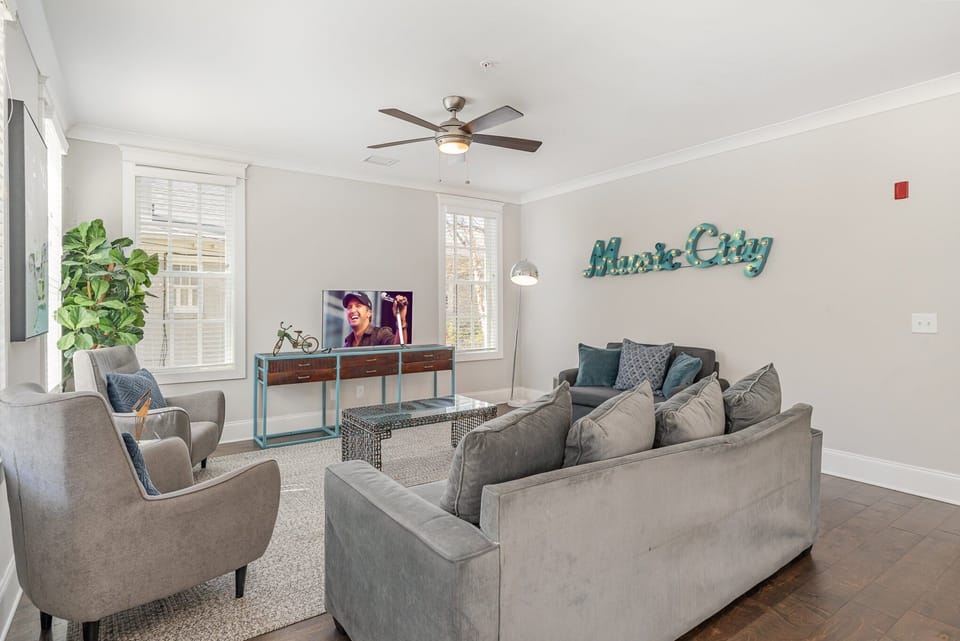 Unit 1 (1st Floor): Open and inviting living space featuring a Smart TV and cozy furnishings.