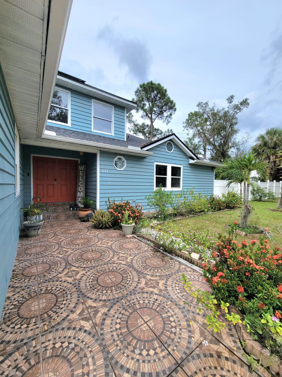 Front Door on right side of driveway 