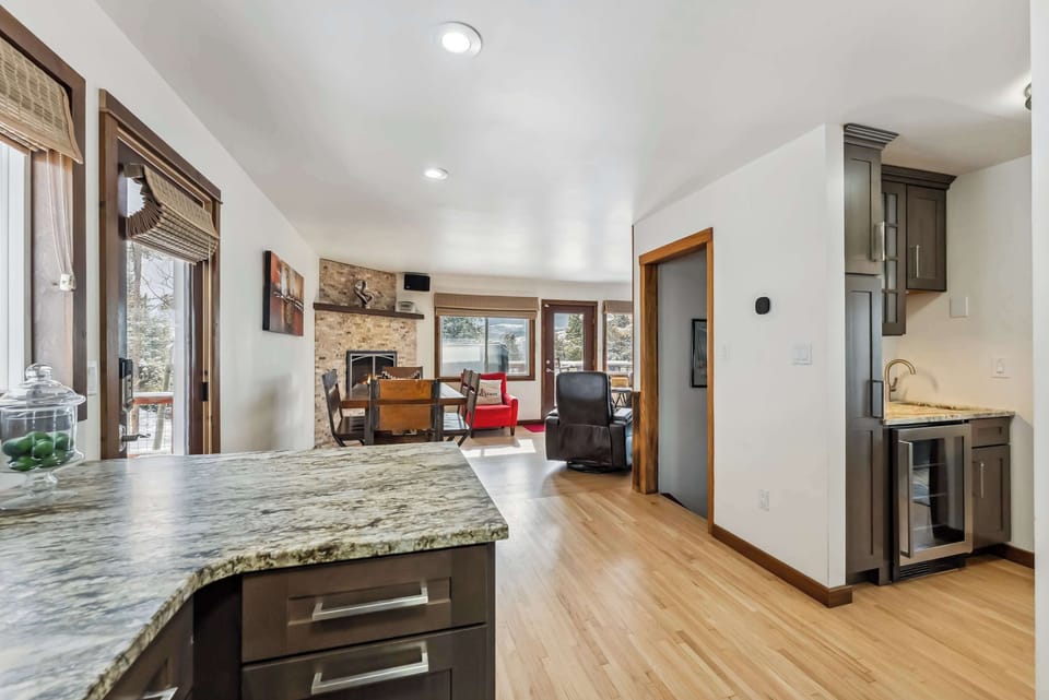Kitchen area overlooking the dining area and fireplace
