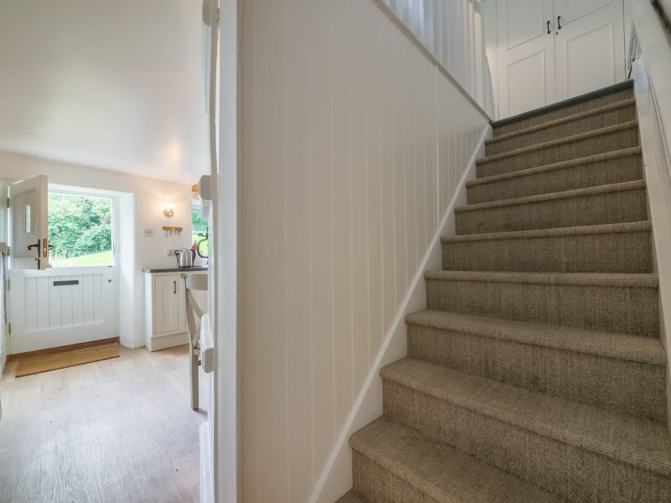 Stairs leading directly to bedroom two, which links to bedroom one