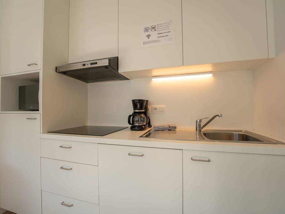 Countertop, Interior Design, Kitchen, Cabinetry, Wood, Kitchen Appliance, Flooring, Kitchen Sink, Floor, Room