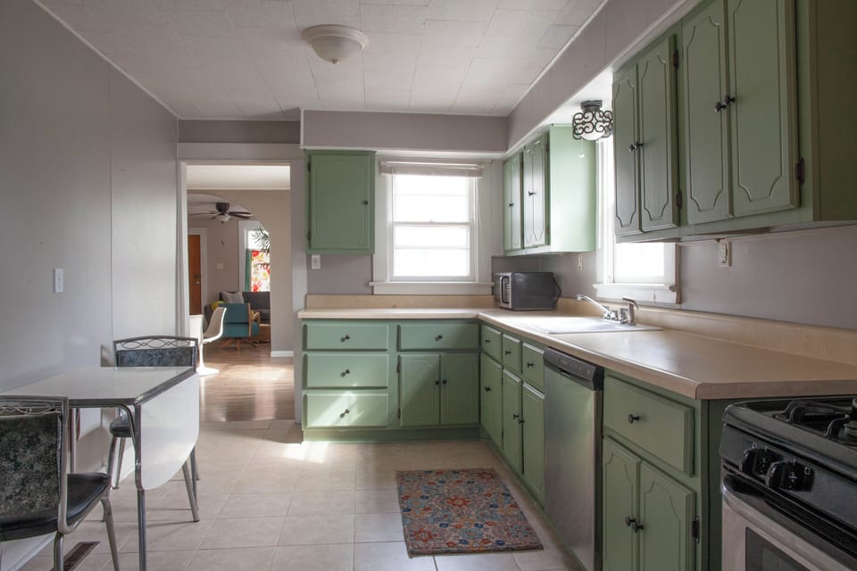 300 sq ft.  Laundry facilities are at opposite end of kitchen.  