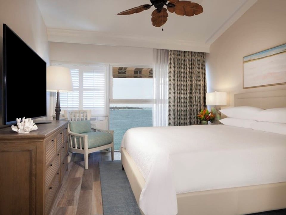 Wake up to soothing ocean views from crisp linens.
