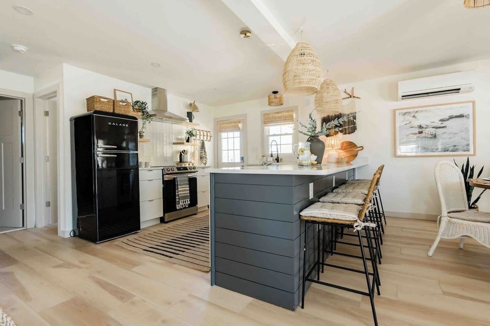 kitchen island with seating for 5 and dining table with seating for 4
