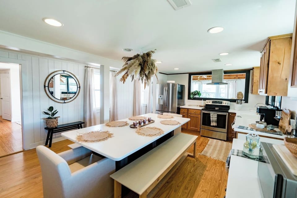 large dining table can fit 10 but there is also an outdoor table on the deck