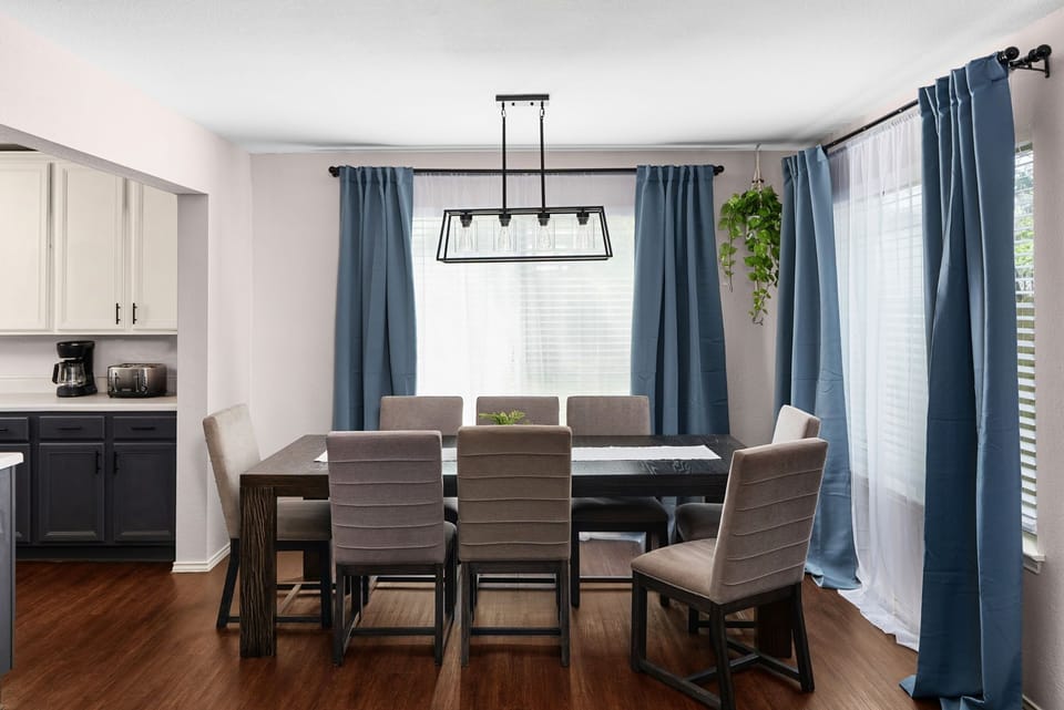 Bright and open dining area seamlessly flows into the kitche