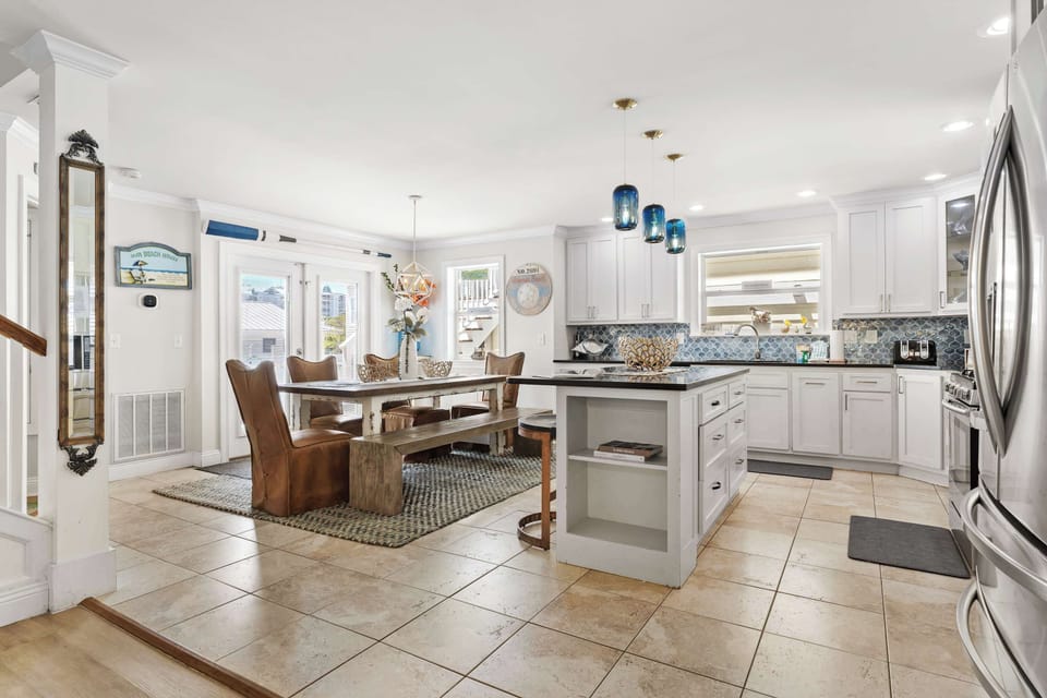 Cook, dine, and unwind in a spacious, open-concept kitchen and living area.