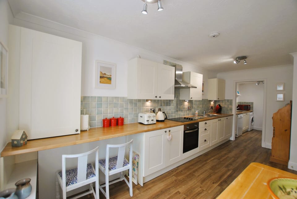 The galley style kitchen is well-equipped