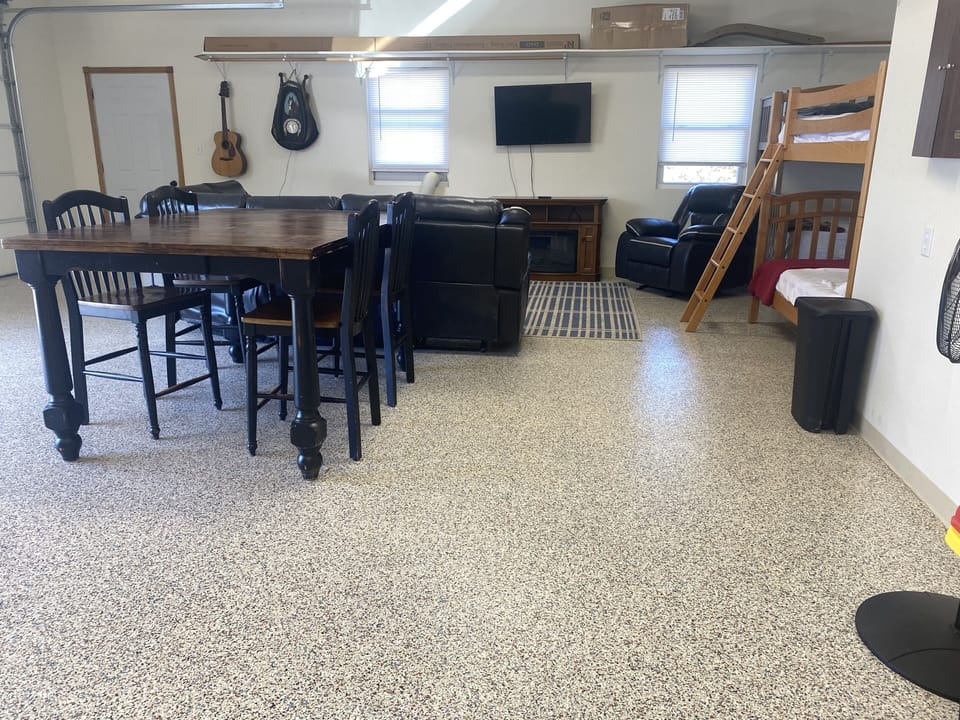 Furnished Bunk House inside of finished and temperature controlled garage.