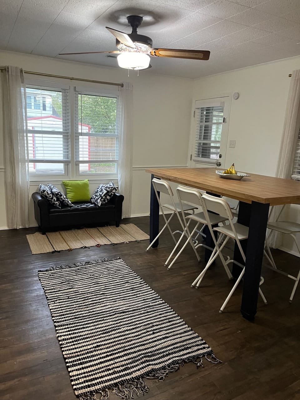 Family room- large windows and vintage cast iron Hunter fan