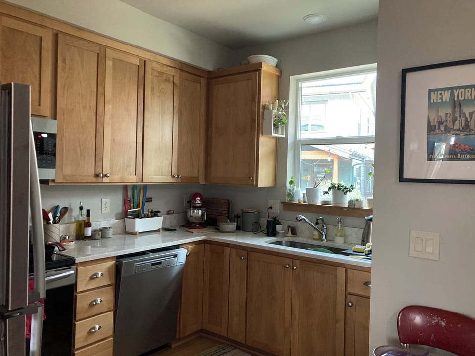 The other end of the main downstairs great room is a full kitchen.