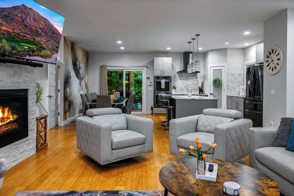 Unwind on the bougie living room couch, binge-watching on the large TV, while effortlessly chatting with family in the kitchen or dining area. 