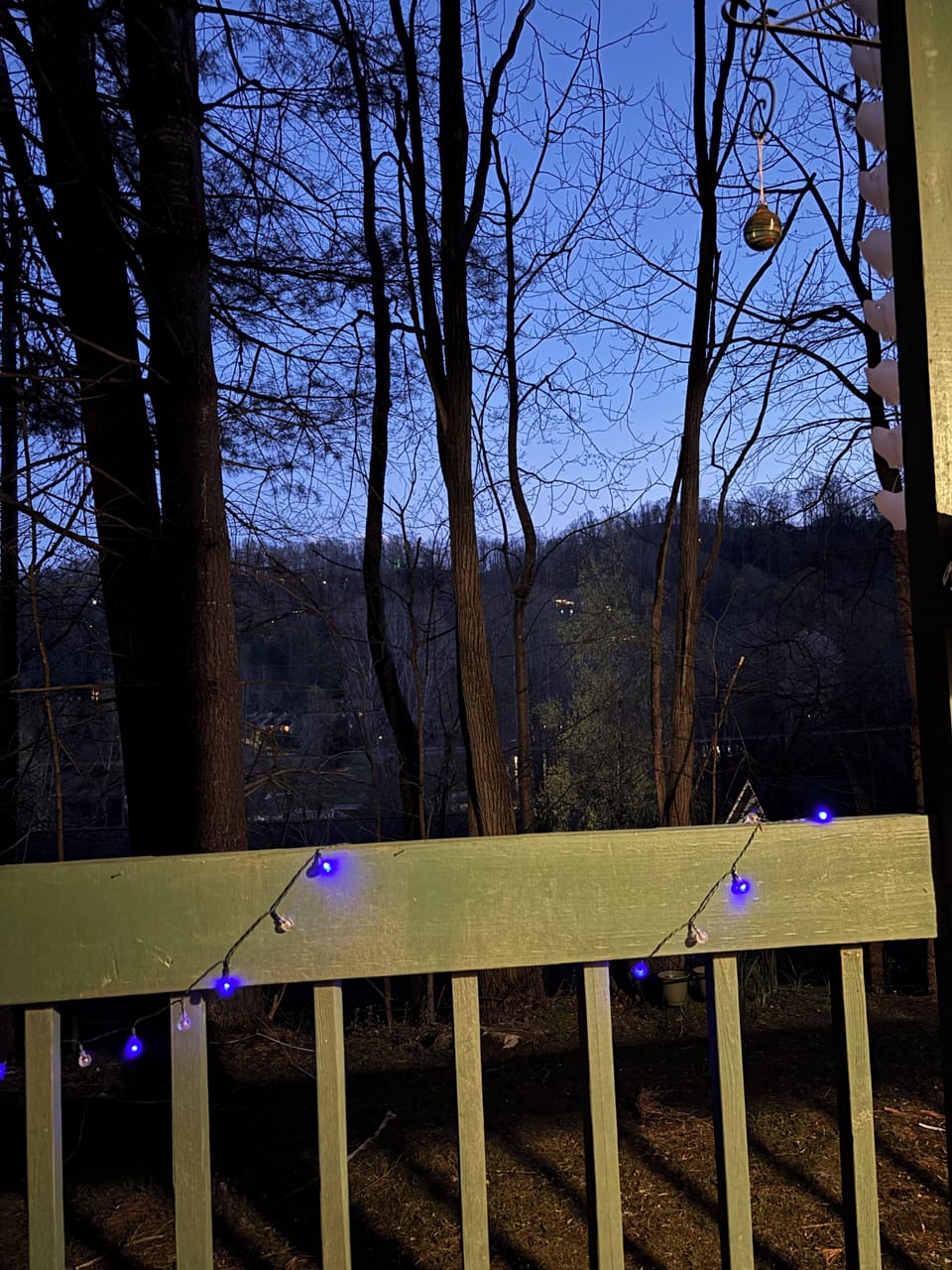 Mountain views from the porch with festive solar lights.