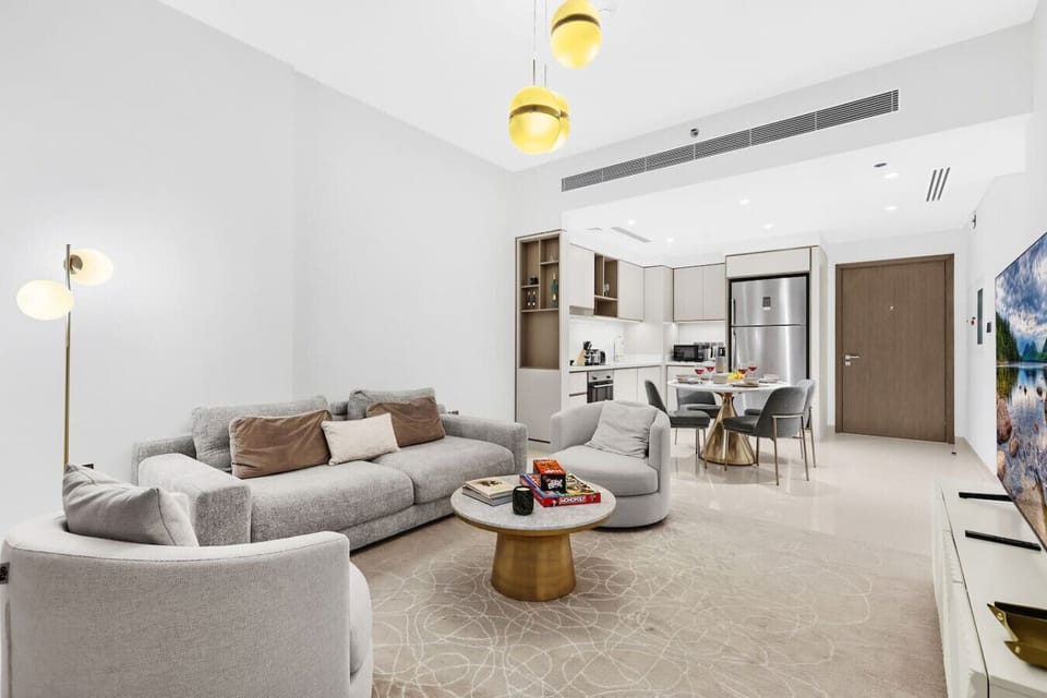 Living Room: Modern elegance with plush seating and a stylish dining area awaits your Dubai adventure!