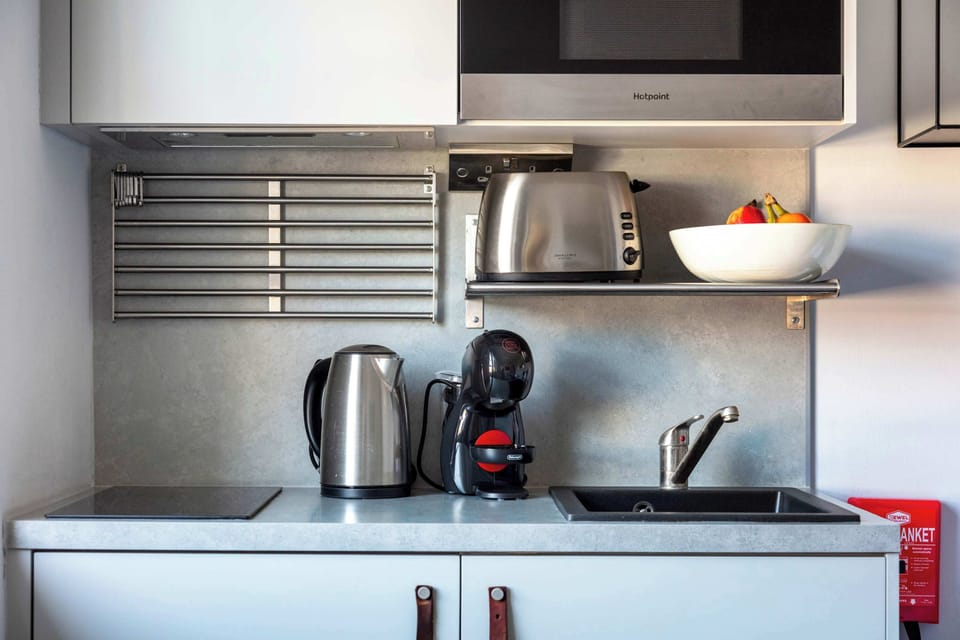 The kitchen is fully equipped to prepare a simple meal 
