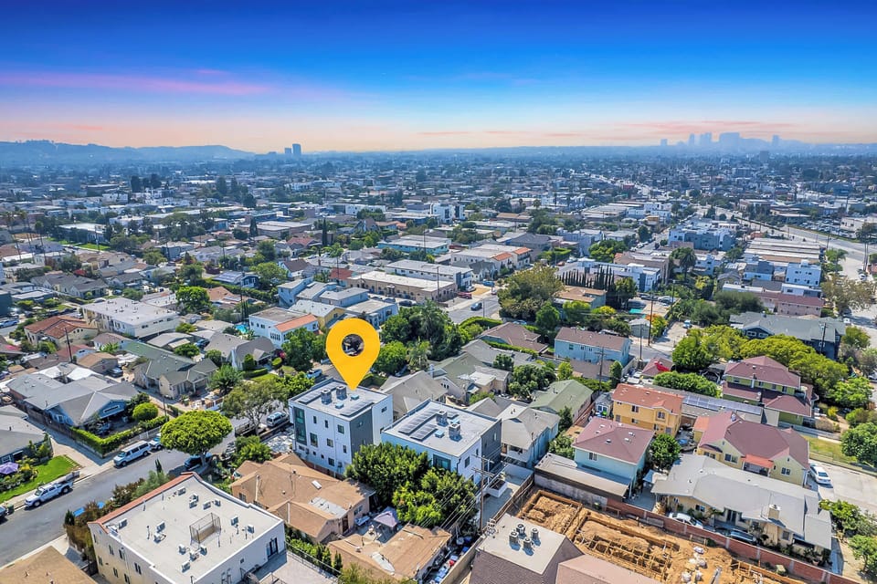 Neighborhood aerial with nearby homes and streets